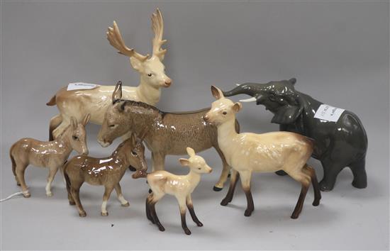 A Beswick figure of a deer, an elephant and donkeys